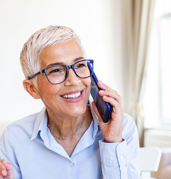 Woman on telephone voting in Port Hope